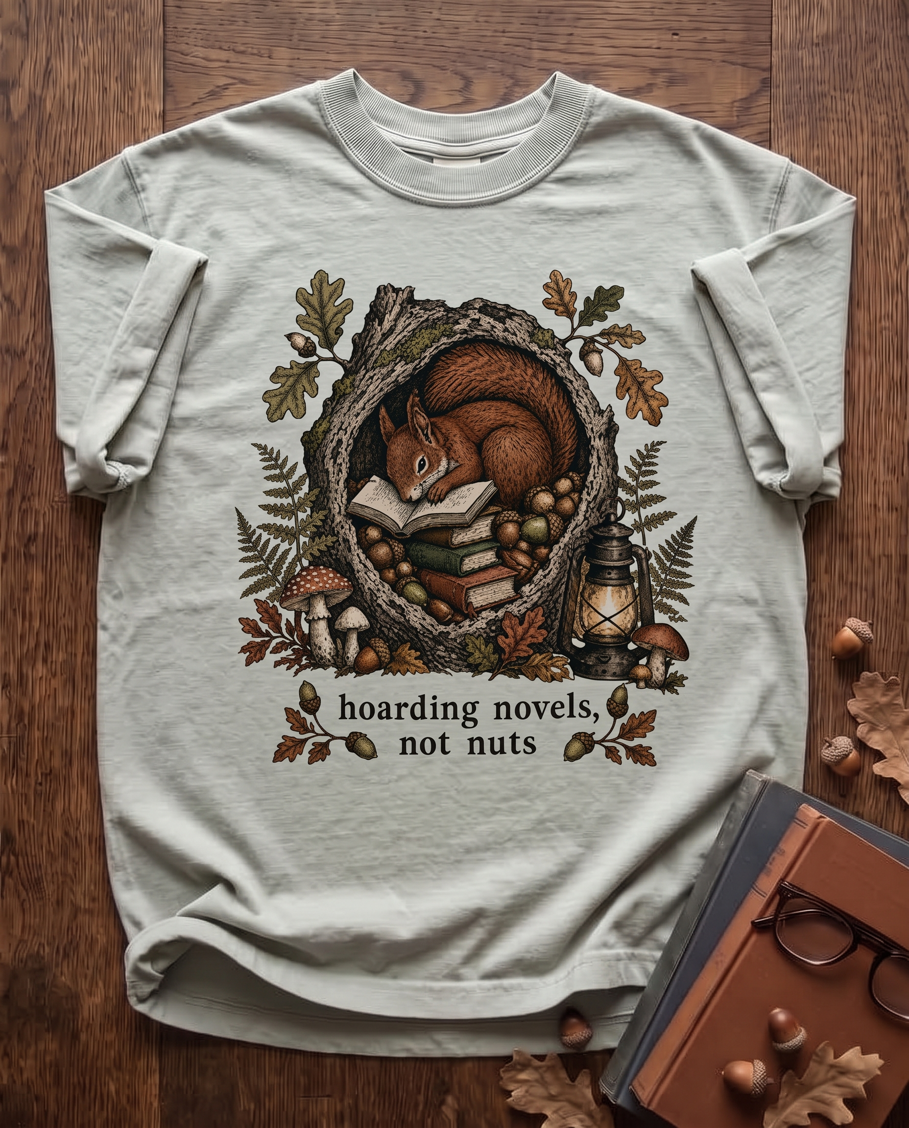 Hoarding Novels, Not Nuts - Bay sage green Comfort Colors tee, styled flat lay