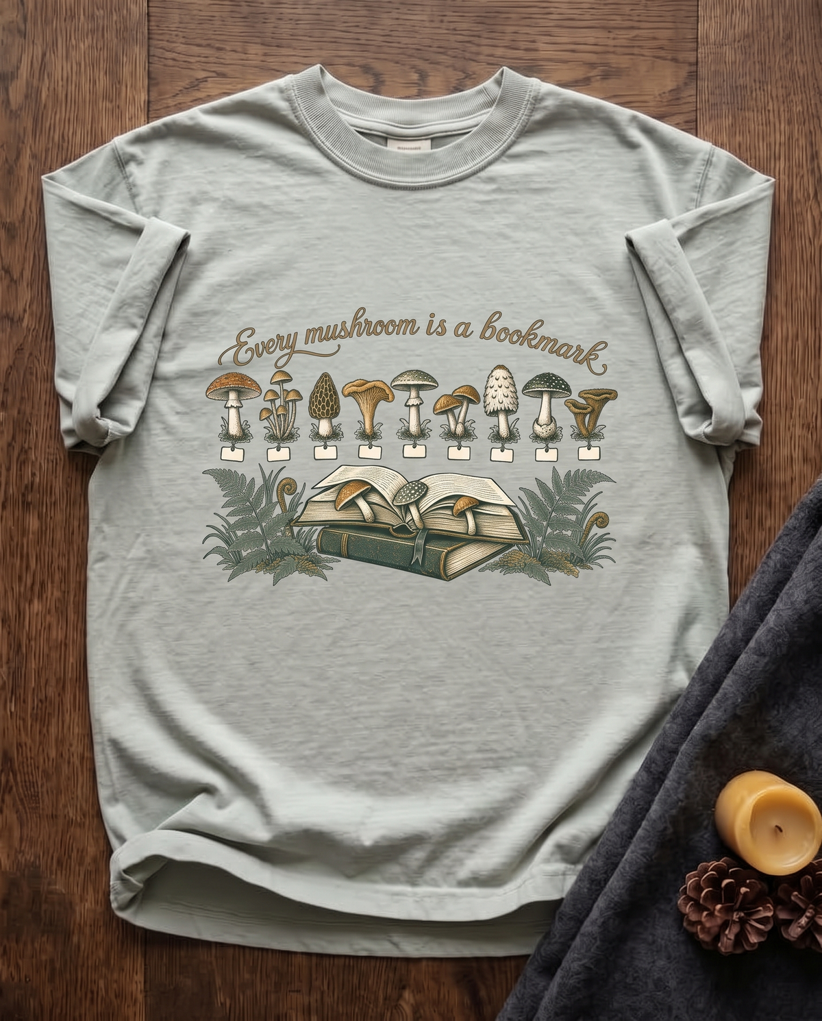 Every Mushroom Is a Bookmark - Bay sage green Comfort Colors tee, styled flat lay